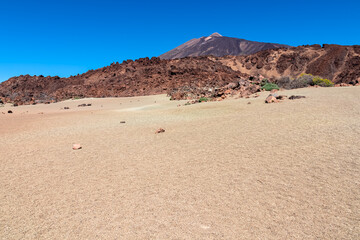 Scenic view on moon landscape of Minas de San Jose Sur near volcano Pico del Teide, Mount El Teide National Park, Tenerife, Canary Islands, Spain, Europe. Lava rocks and pumice field on desert terrain