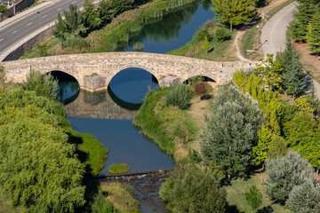 Fototapeta na wymiar Puente romano sobre el río Ucero y Torre del agua, Soria, Comunidad Autónoma de Castilla, Spain, Europe
