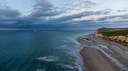 aerial drone shot of the Seascape of the opal coast of Cap Blanc Nez, showing the Monument at Cape white Nose France on top of the chalk cliffs. High quality photo