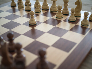 Wooden chess board with Stauton Nº5 wooden pieces. Concept of struggle and intellectual improvement