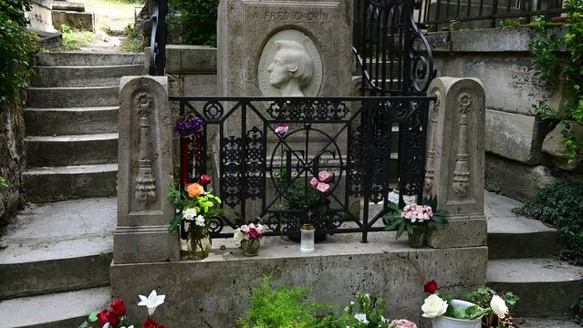 Paris, France. June 2022. At the quaint and historic Père-Lachaise cemetery, tilt footage of the grave of famous classical music composer Fryderyk Chopin
