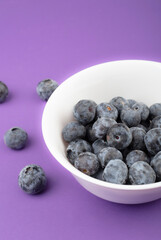 Blueberry berry background. Macro. Fresh blueberry background. Water drops on ripe blueberries. Background from freshly picked blueberries, close-up. Blue berries of blueberry close-up, macro