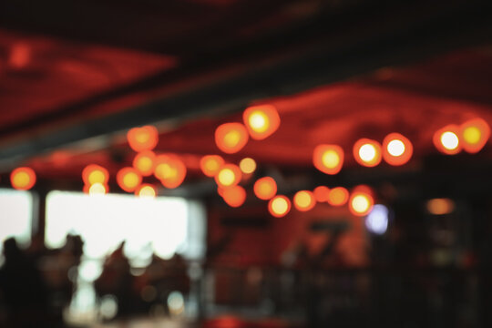 Blurred photo of restaurant with many lights
