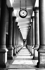 Karlovy Vary Czech Republic symmetric columns with analog clock on the top black and white photo...