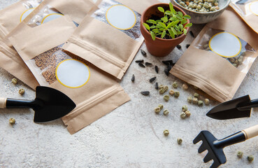Fototapeta na wymiar Microgreen seeds in paper bags and equipment for sowing microgreens.