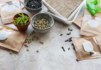 Microgreen seeds in paper bags and equipment for sowing microgreens.