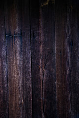 The background is made of old wooden planks. Close-up of the old wooden wall