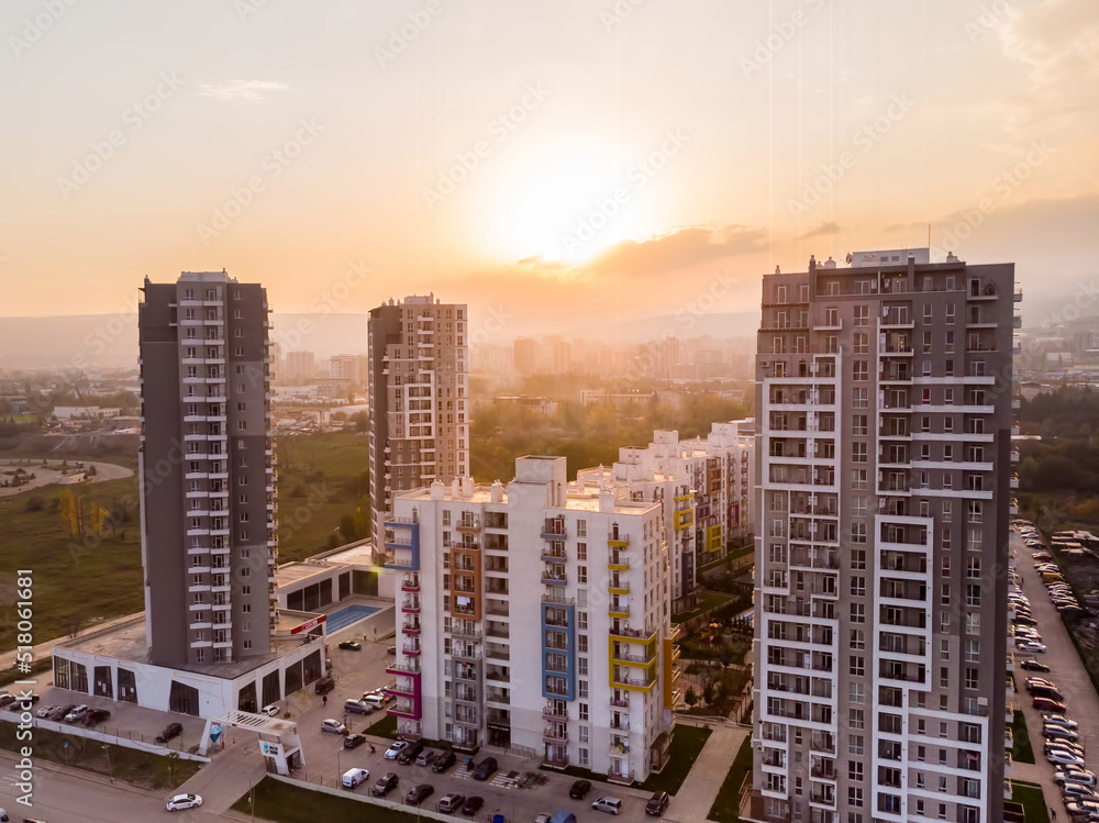 Wall mural tbilisi, georgia - 17th october, 2021: green diamond apartments complex buildings panorama with sunn