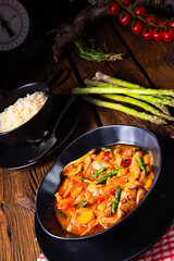 colorful turkey fricassee with asparagus and paprika
