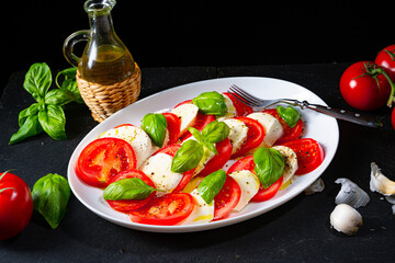 Tomato with mozzarella and basil