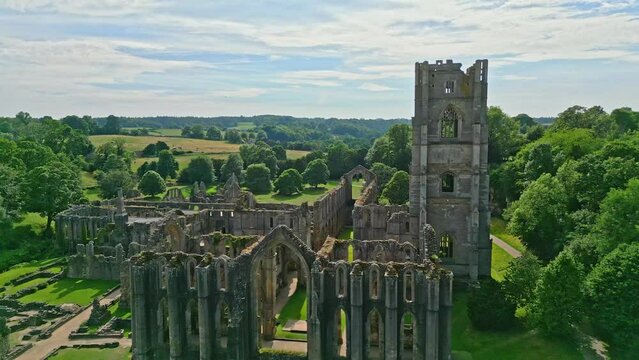 Drone aerial footage of the  historical 13th century Fountains Abby ruins in North Yorkshire - England UK