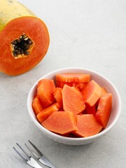 Healthy and fresh cut papaya fruit or sliced ​​papaya, served in a bowl

