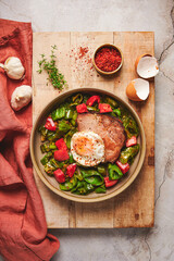 Fried peppers, roasted pork and egg