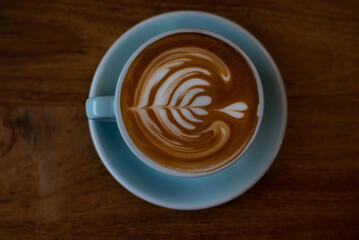 Coffee cup on wooden table.