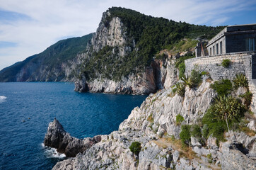 View to rock near Byron's Grotto or Grotta di Lord Byron in Porto Venere, Liguria, Italy. Сliffs on Mediterranean coast of Italian Riviera. Rocky coastline of Ligurian sea near La Spezia
