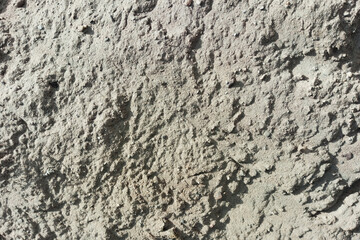 Background texture of pile of sand. Grey colour.