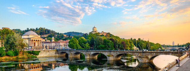 Turin, Italy. Panoramic view at sunset of the Po River, the Church of the Gran Madre, the Church of...