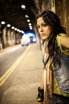 Urban Fashion. A beautiful young mixed race model on location waiting. From a series of images with the same model.