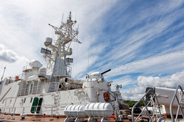 Closeup view of sea warship against cloudy blue sky