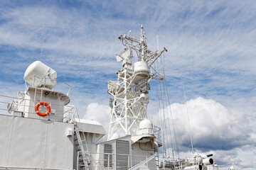 Closeup view of sea warship against cloudy blue sky