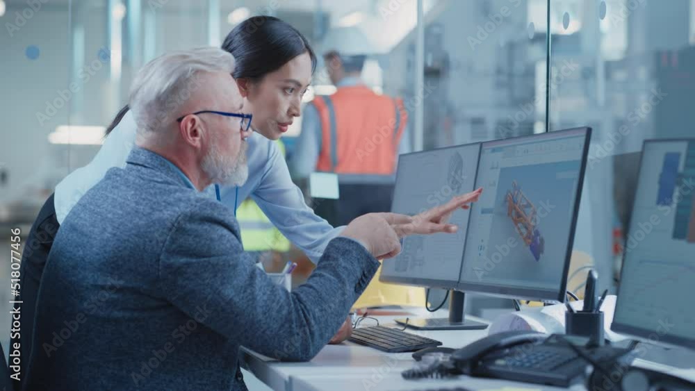 Leinwandbilder factory office design agency: industrial engineers talking about 3d layouts of a heavy industry mach