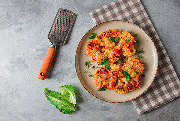 Steak, cauliflower , with cheese , spices, homemade, on a light gray table, close-up, top view, selective focus, no people,