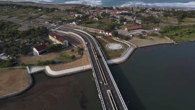 Aerial view, the new bridge of Kretek 2. The bridge that has the Keris icon. The southern causeway of Yogyakarta (JLLS) passes through the Depok lagoon.