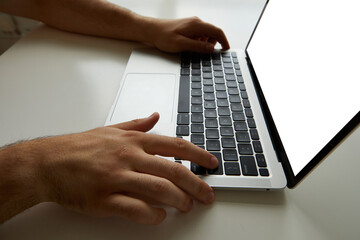 male hands on laptop keyboard close-up with clipping path display