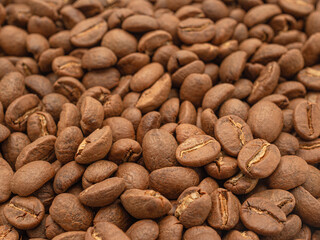 Macro shot of fresh aromatic roasted coffee beans