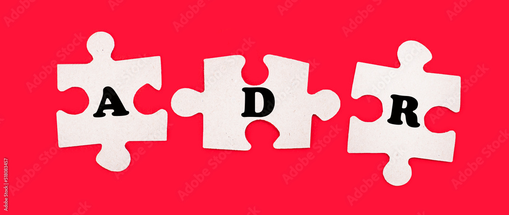 Poster three white jigsaw puzzles with the text adr alternative dispute resolution on a bright red backgrou