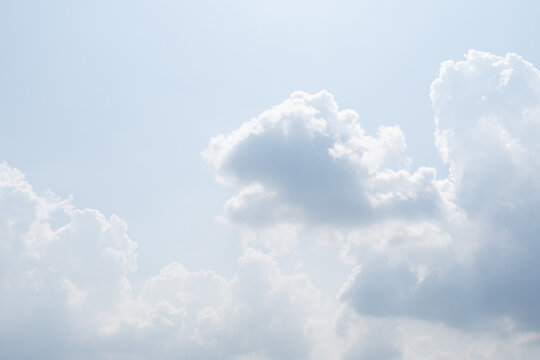 White clouds floating in the blue sky. © two K