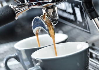 Professional espresso machine while preparing two espressos. Coffee machine.