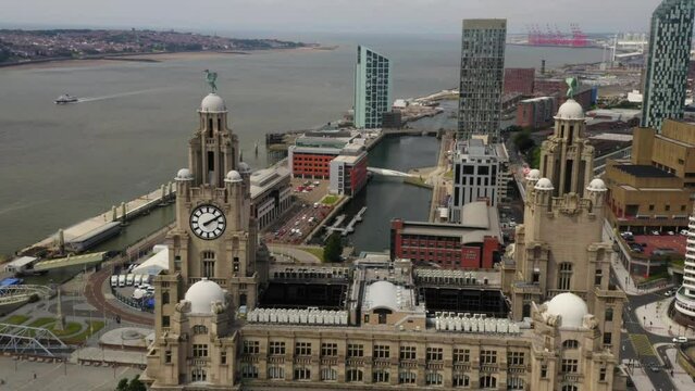 Liverpool liver building fly past showing city sky line and river Mersey.