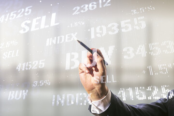 Man hand with pen working with abstract virtual financial graph on blurred office background, financial and trading concept. Multiexposure
