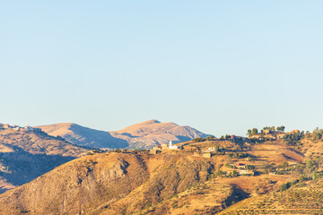 Low angle view of a small village on top of the mountain.