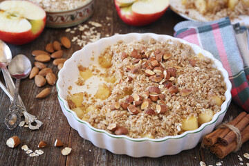 Fresh apple crumble from oatmeal, almondes dressing for healthy breakfast