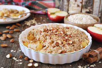 Fresh apple crumble from oatmeal, almondes dressing for healthy breakfast
