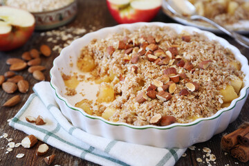 Fresh apple crumble from oatmeal, almondes dressing for healthy breakfast