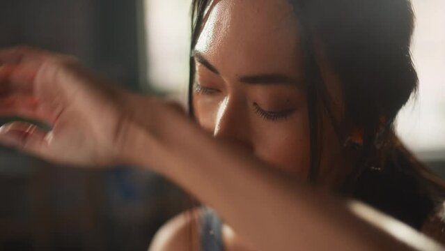 Strong Woman Covered in Sweat Rests after Workout. Successful Empowered Woman Fighting and Winning. Cinematic Stylish Sensual Close-up Shot of a Neck, Chest and Part Of Anonymous Face