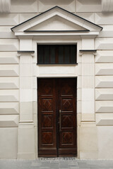 Obraz na płótnie Canvas View of building with vintage wooden door. Exterior design