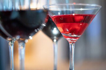 wine glass stem and colorful drinks at a party in the banquet hall.