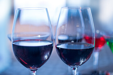wine glass stem and colorful drinks at a party in the banquet hall.