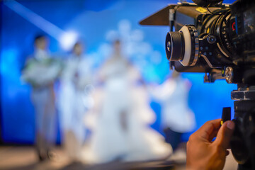 Select focus of Focus ring professional camcorder Wedding blur background on stage in the big...