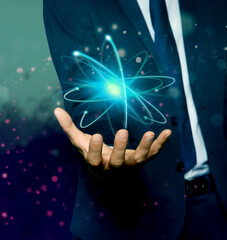 Man holding virtual model of atom on color background, closeup
