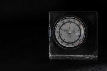 70s table vintage barometer on a black background