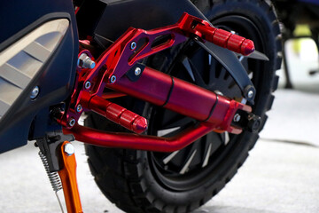 Fototapeta na wymiar Sport electric motorcycle or side view of new red electric motorbike with stand on