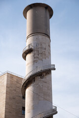 View up to the majestic Italian Water tower with stairs around it and with clear blue sky in...