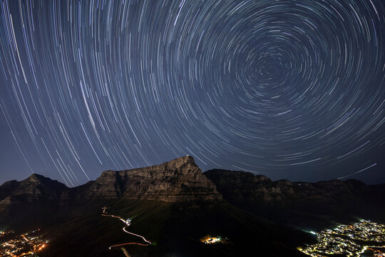 View of Table Mountain with star trail form Lion&rsquo;s Head mountain, Cape Town, Cape Town, South Africa.