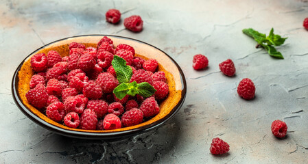Organic raspberries, Fresh raspberries in bowl. Ripe juicy fresh raspberries. healthy food, vitamins, summer berry fruit. Long banner format. place for text