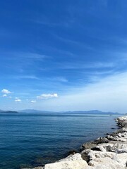 landscape with sea and sky.  Serenity. Clear sea and sky with mountains background. Italy. 